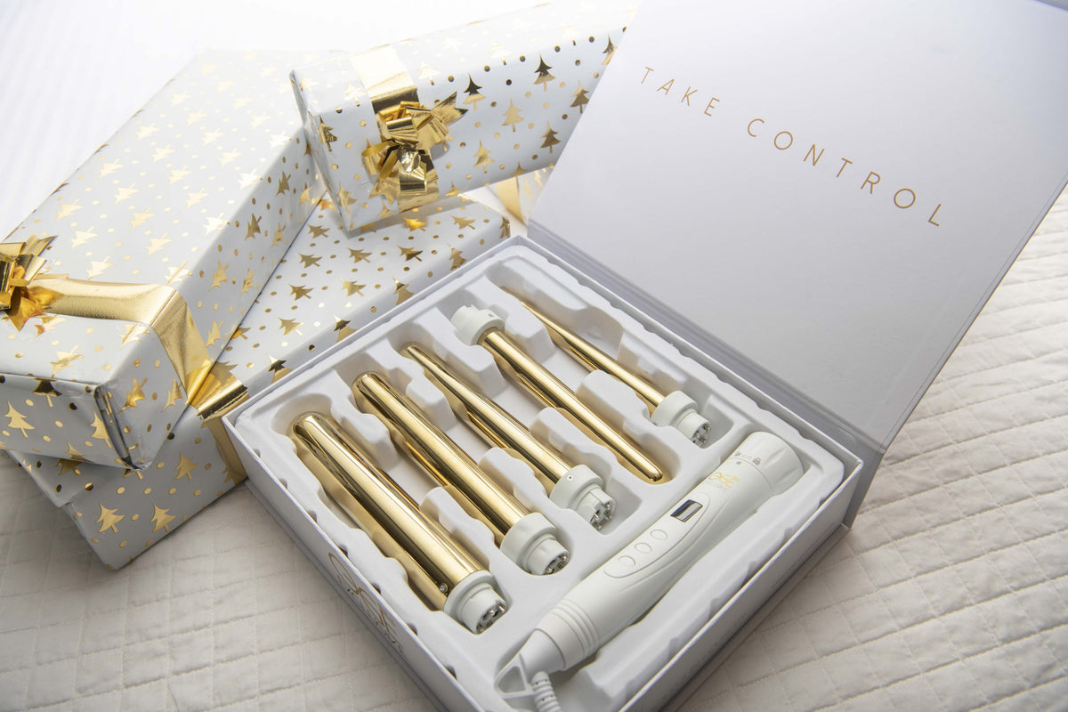 Geopende cadeaudoos van Ogé Exclusive met een stijltang erin